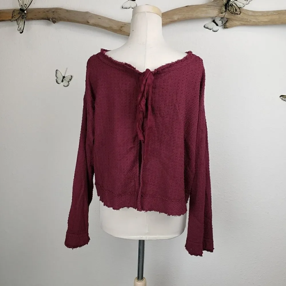 Free people frayed hem bell sleeve maroon top